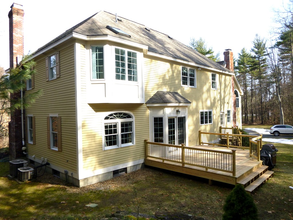 175 Robinson Road Boxborough, MA 01719 - Photo 23 of 30 a view of a house with a yard