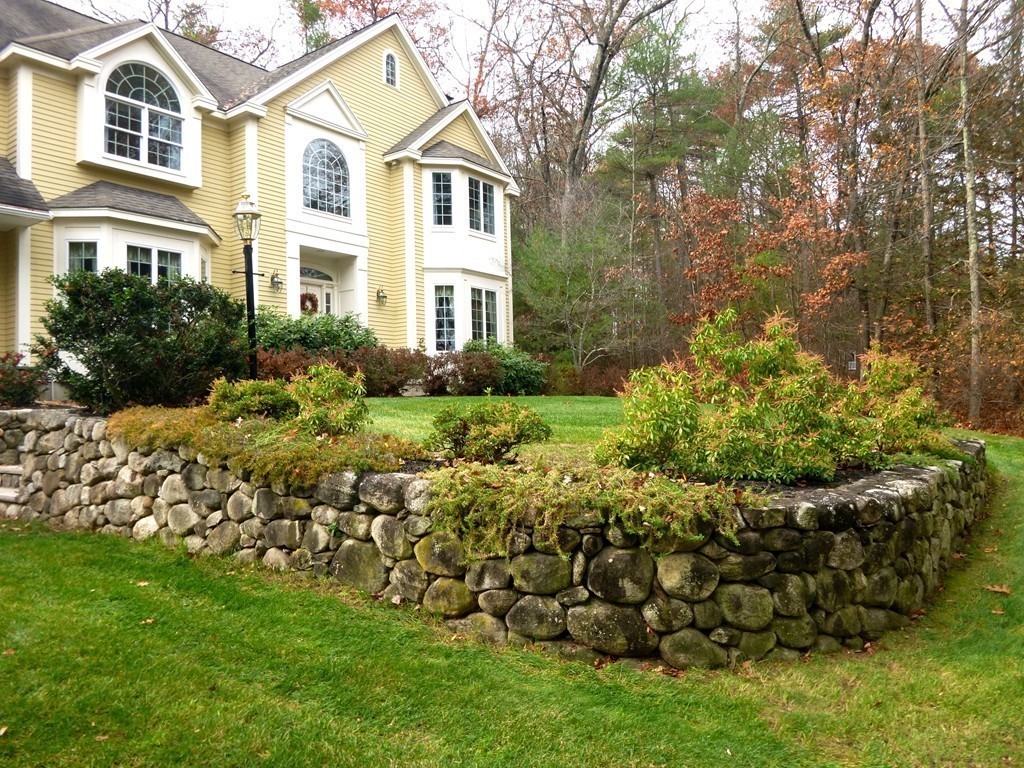 175 Robinson Road Boxborough, MA 01719 - Photo 28 of 30 a front view of a house with a garden
