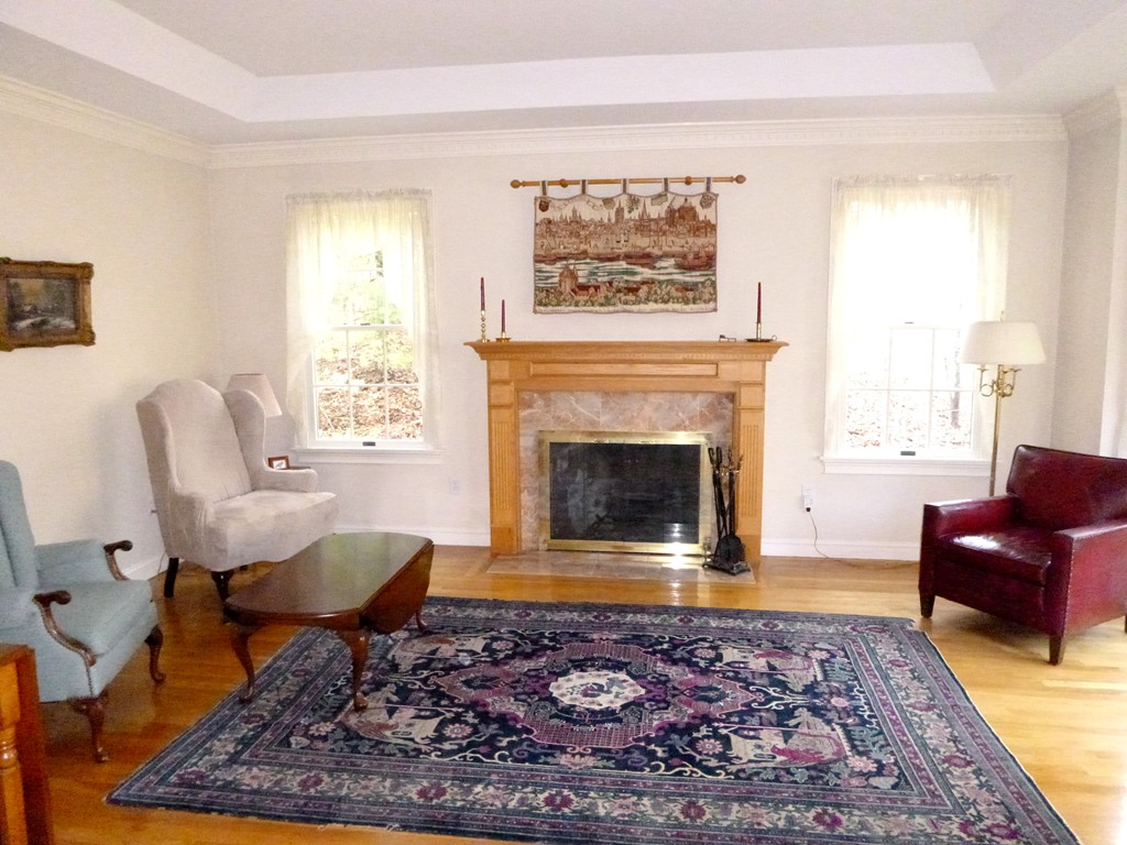 175 Robinson Road Boxborough, MA 01719 - Photo 3 of 30 a living room with furniture and a fireplace