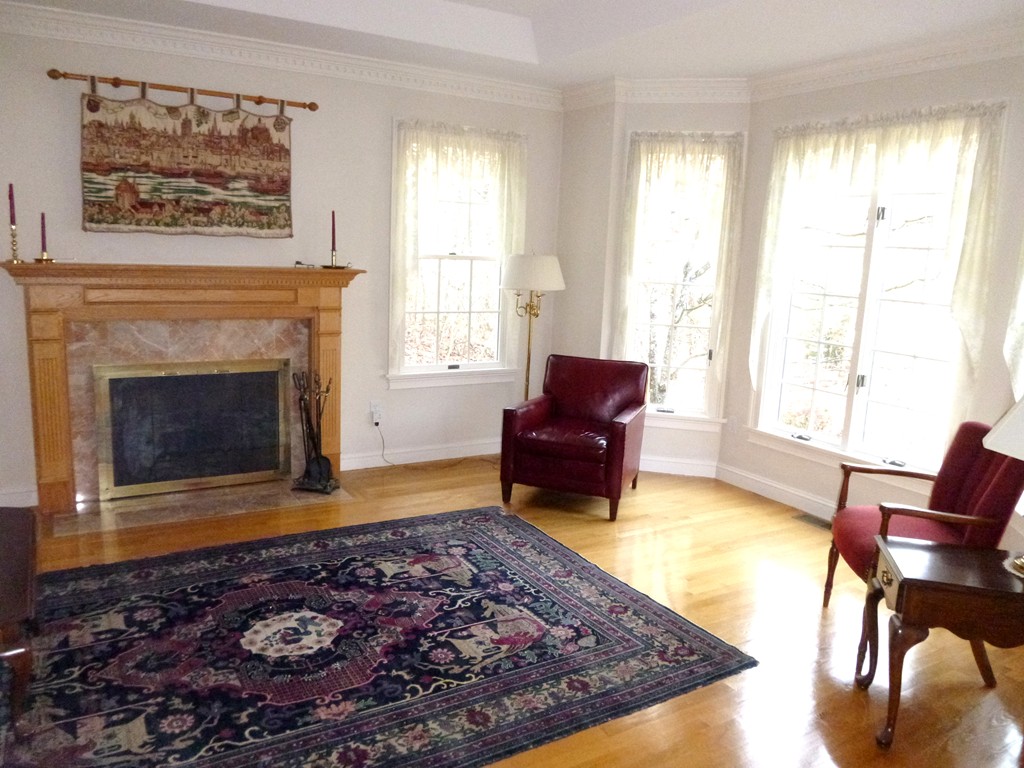 175 Robinson Road Boxborough, MA 01719 - Photo 4 of 30 a living room with furniture and a fireplace