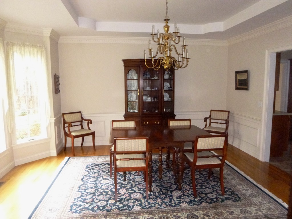 175 Robinson Road Boxborough, MA 01719 - Photo 5 of 30 a view of a dining room with furniture and a chandelier