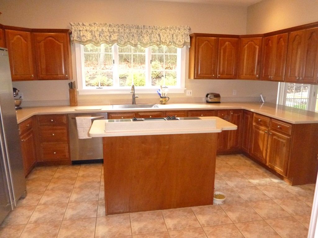 175 Robinson Road Boxborough, MA 01719 - Photo 6 of 30 a kitchen with stainless steel appliances granite countertop a stove a sink dishwasher and a refrigerator