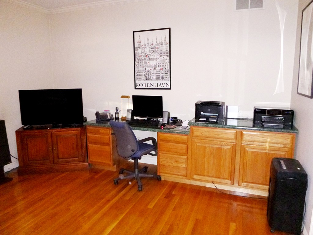 175 Robinson Road Boxborough, MA 01719 - Photo 10 of 30 a view of a livingroom with furniture and a flat screen tv