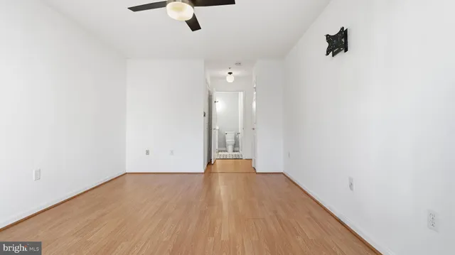 a view of hallway with wooden floor