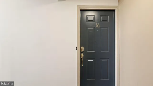 wooden floor in an empty room with a fireplace