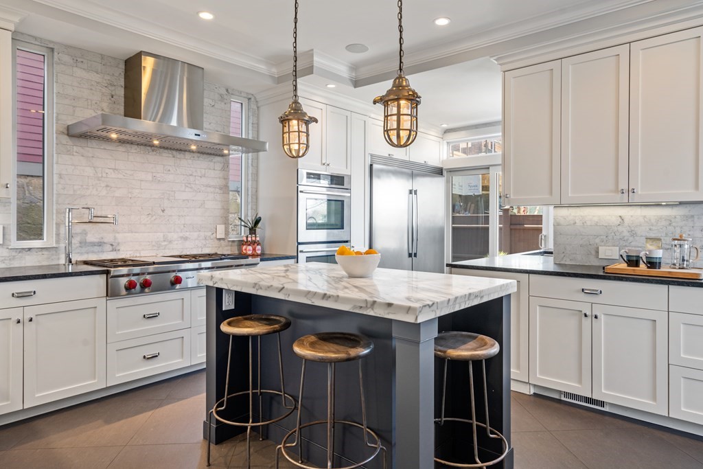 19 Salcombe Street Boston, MA 02125 - Photo 2 of 40 a kitchen with stainless steel appliances granite countertop a sink a stove and a wooden floors