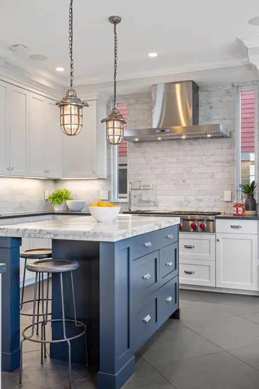 19 Salcombe Street Boston, MA 02125 - Photo 22 of 40 a kitchen with a sink a counter space appliances and cabinets