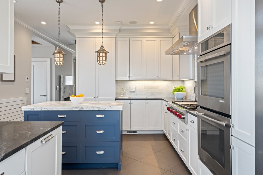 19 Salcombe Street Boston, MA 02125 - Photo 23 of 40 a kitchen with a sink stove and cabinets