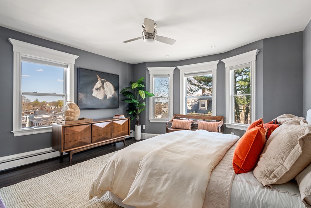 19 Salcombe Street Boston, MA 02125 - Photo 29 of 40 a bedroom with a bed and a large window with the outer view