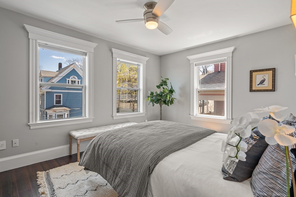 19 Salcombe Street Boston, MA 02125 - Photo 30 of 40 a bedroom with a bed painting on wall and a window