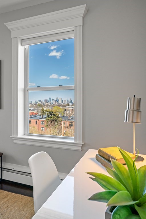 19 Salcombe Street Boston, MA 02125 - Photo 32 of 40 a bedroom with a bed and a window