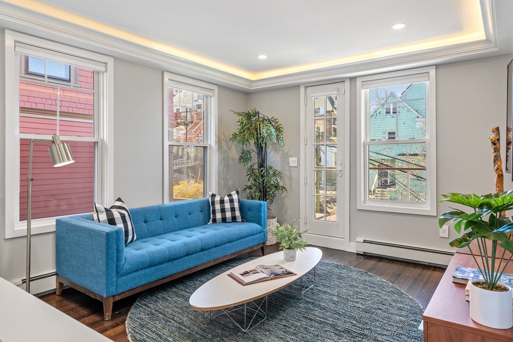 19 Salcombe Street Boston, MA 02125 - Photo 34 of 40 a living room with furniture and a large window