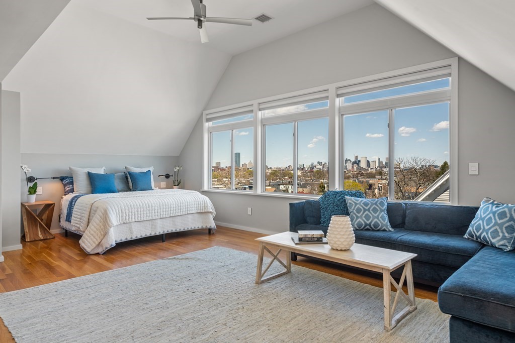 19 Salcombe Street Boston, MA 02125 - Photo 4 of 40 a bedroom with a bed and glass window