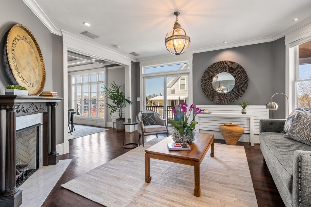 19 Salcombe Street Boston, MA 02125 - Photo 5 of 40 a living room with furniture and a fireplace