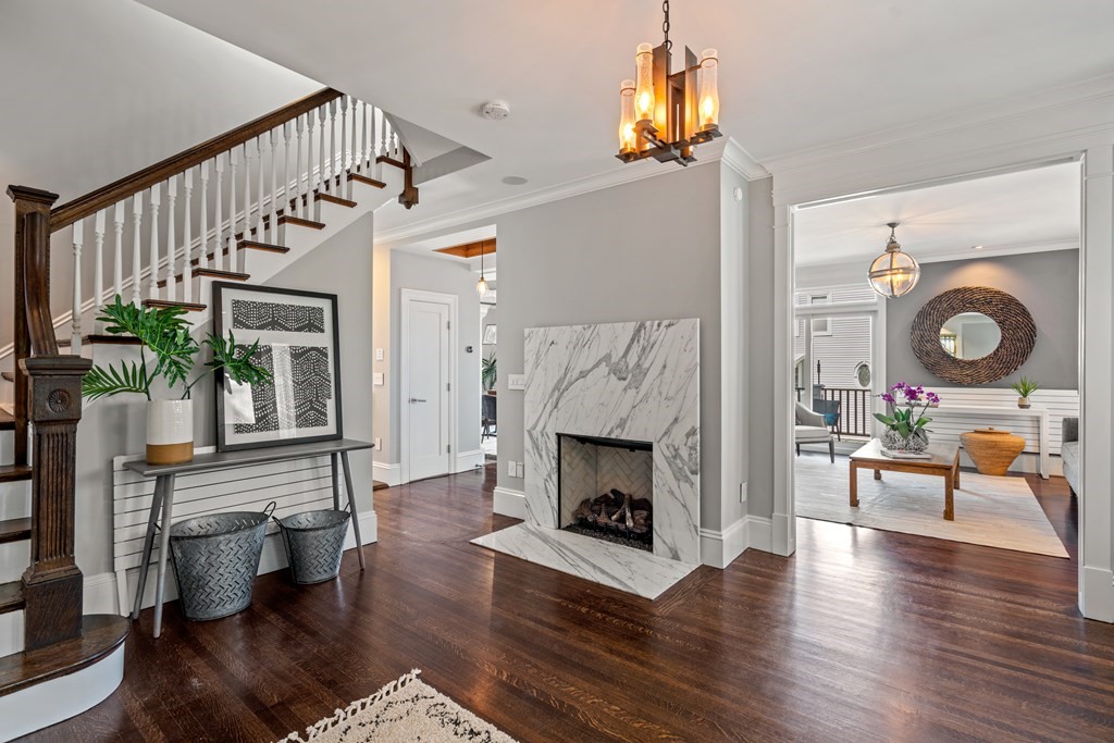 19 Salcombe Street Boston, MA 02125 - Photo 6 of 40 a living room with furniture wooden floor and a fireplace