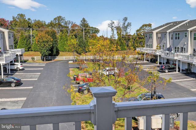 a bedroom with bed and a flat screen tv