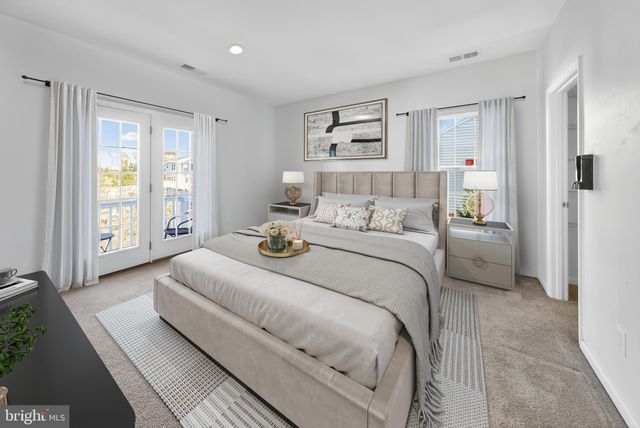 a bathroom with a granite countertop sink a mirror and a shower
