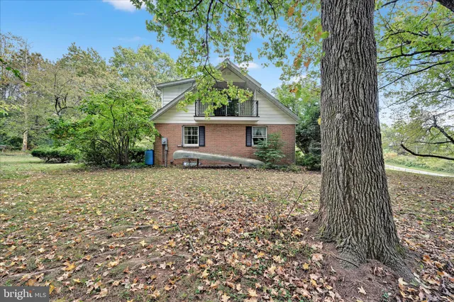 a house with a tree in front of it