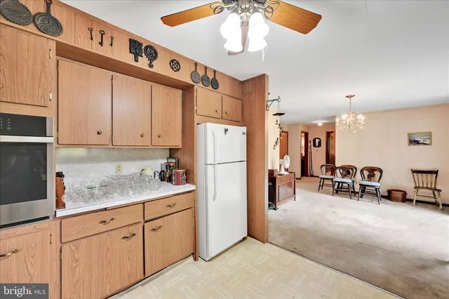 a kitchen with refrigerator cabinets and furniture
