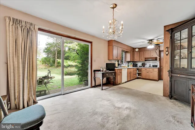 a view of a kitchen with furniture a kitchen view and a window