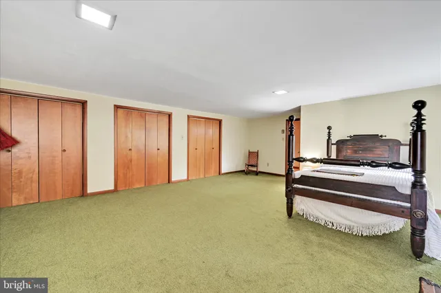 a bedroom with bed and window