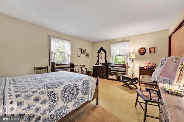 a bed room with a bed and furniture