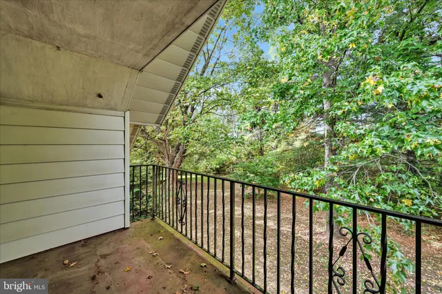 a view of a balcony with a pot
