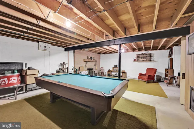 a room with furniture and pool table