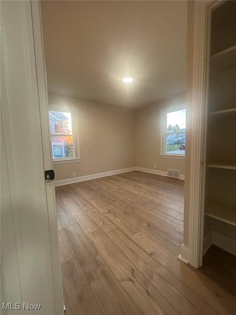 15410 Turney Road Maple Heights, OH 44137 - Photo 25 of 46 Empty room with light wood finished floors and baseboards