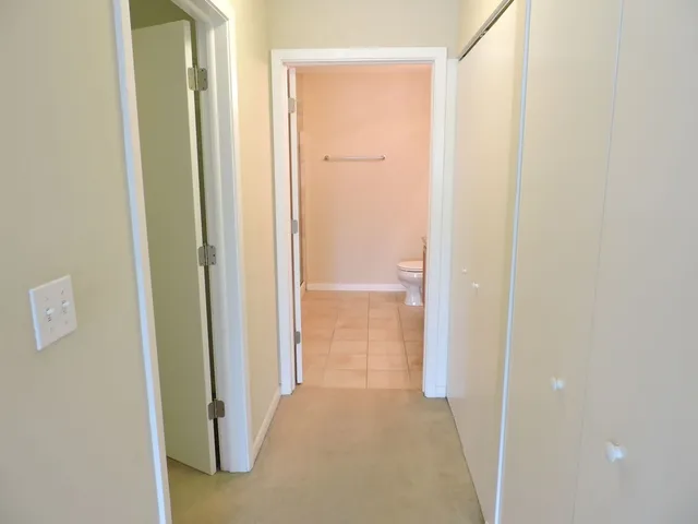 a view of a bathroom from a hallway