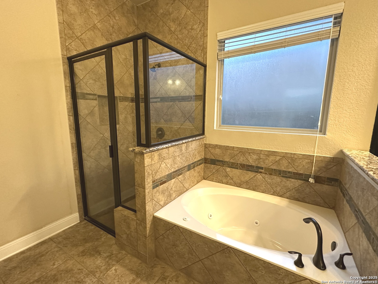 24507 Chianti Way San Antonio, TX 78260 - Photo 14 of 26 a bathroom with a tub and shower