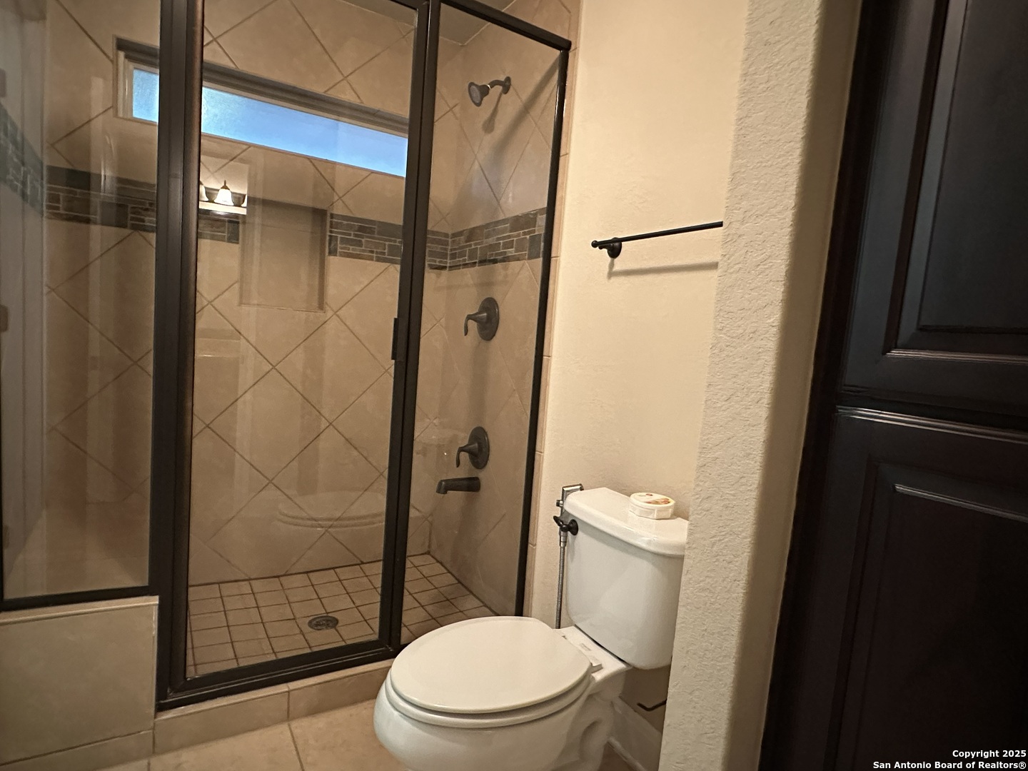 24507 Chianti Way San Antonio, TX 78260 - Photo 19 of 26 a white toilet sitting next to a bathroom sink