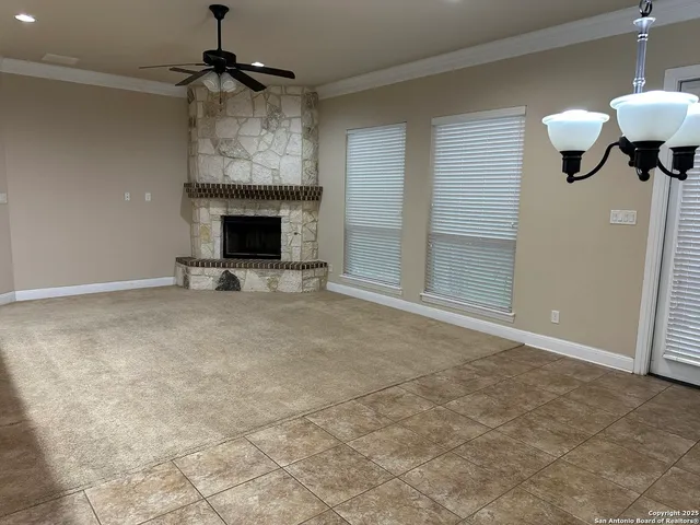 a view of an empty room with a fireplace