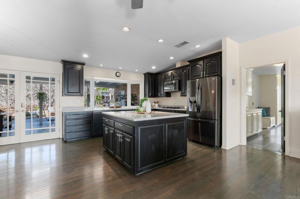 3326 Monroe Street Carlsbad, CA 92008 - Photo 14 of 63 a kitchen with stainless steel appliances granite countertop a stove and a refrigerator