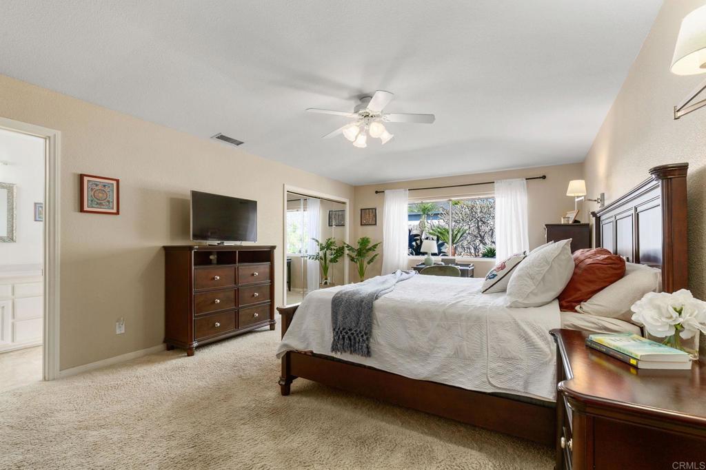 3326 Monroe Street Carlsbad, CA 92008 - Photo 22 of 63 a bedroom with a bed and a flat screen tv