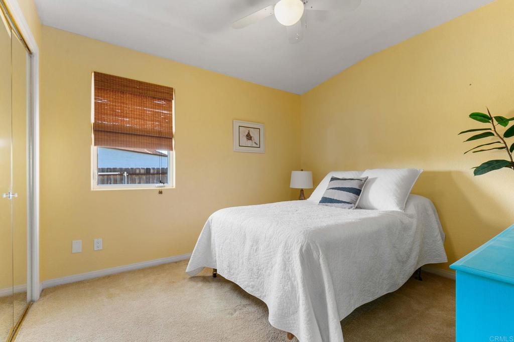 3326 Monroe Street Carlsbad, CA 92008 - Photo 25 of 63 a bedroom with a bed and wall painting