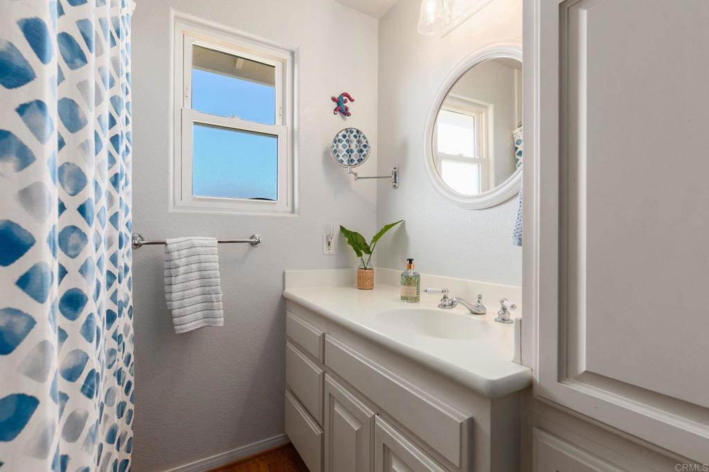 3326 Monroe Street Carlsbad, CA 92008 - Photo 27 of 63 a bathroom with a sink and a mirror