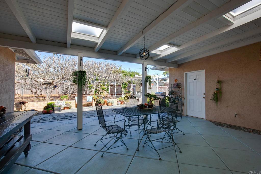 3326 Monroe Street Carlsbad, CA 92008 - Photo 28 of 63 a outdoor space with lots of tables a large window and chairs