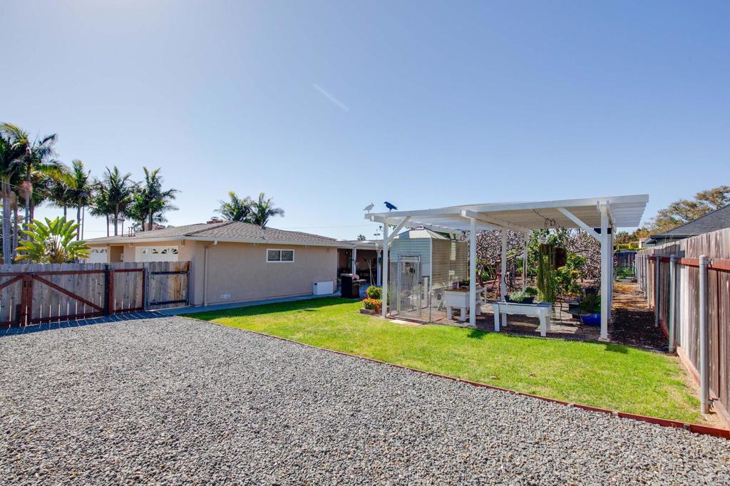 3326 Monroe Street Carlsbad, CA 92008 - Photo 33 of 63 a view of a backyard with a small cabin and a chair