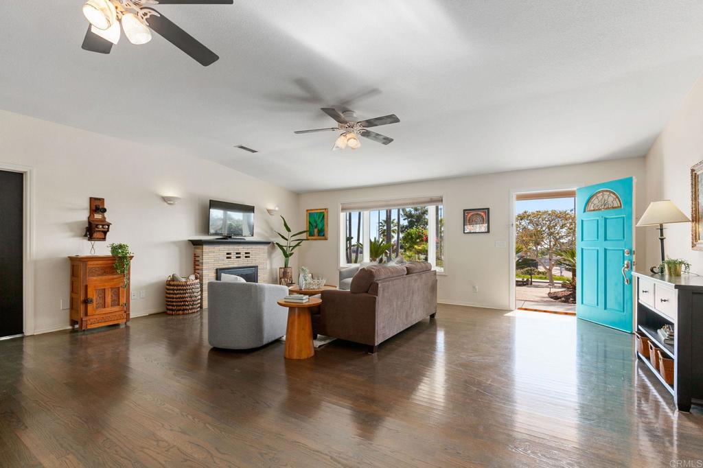 3326 Monroe Street Carlsbad, CA 92008 - Photo 5 of 63 a living room with furniture and a wooden floor
