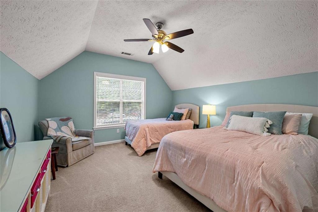 128 Byrom Road Senoia, GA 30276 - Photo 42 of 83 a bedroom with two beds and windows