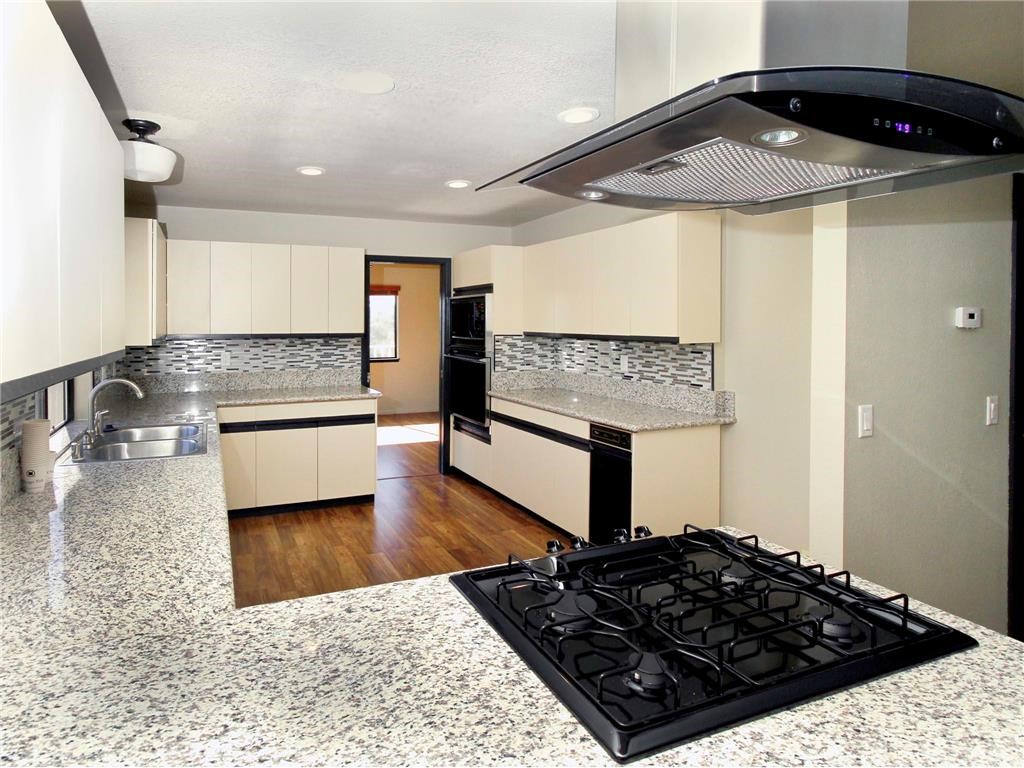 30451 San Pasqual Road Temecula, CA 92591 - Photo 2 of 2 a kitchen with a stove and a refrigerator
