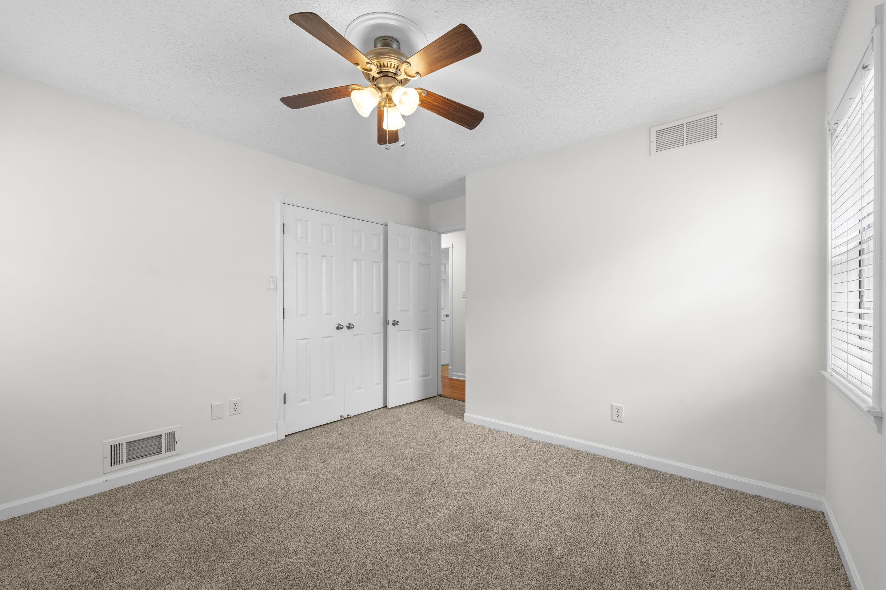 499 Duscoe Street Collierville, TN 38017 - Photo 22 of 38 an empty room with a window and a fan