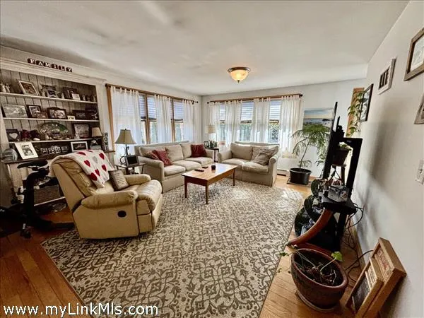 a living room with furniture or couch and a window