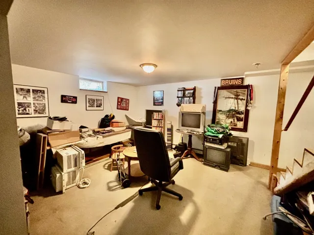 a view of a livingroom with workspace and a couch