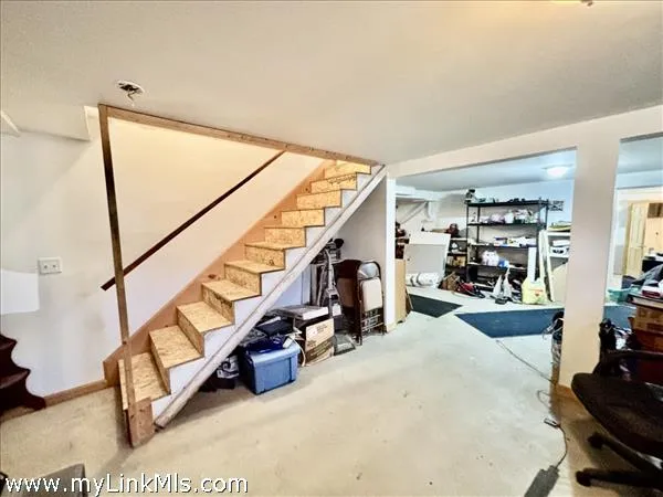 a living room with lots of furniture and a wooden floor