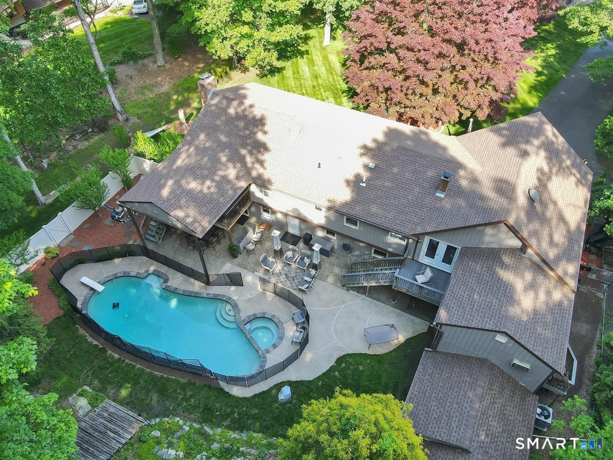122 Ridgeview Circle Guilford, CT 06437 - Photo 34 of 40 Aerial photo showing the home, pool, and both front and back yards, highlighting the property's setting and outdoor living spaces. NOTE: NEW roof replaced in 2022