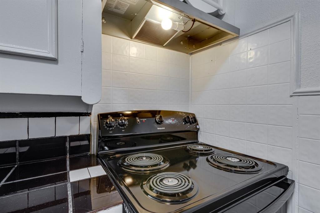 617 Wilson Street Lancaster, TX 75146 - Photo 15 of 30 a stove top oven sitting inside of a kitchen