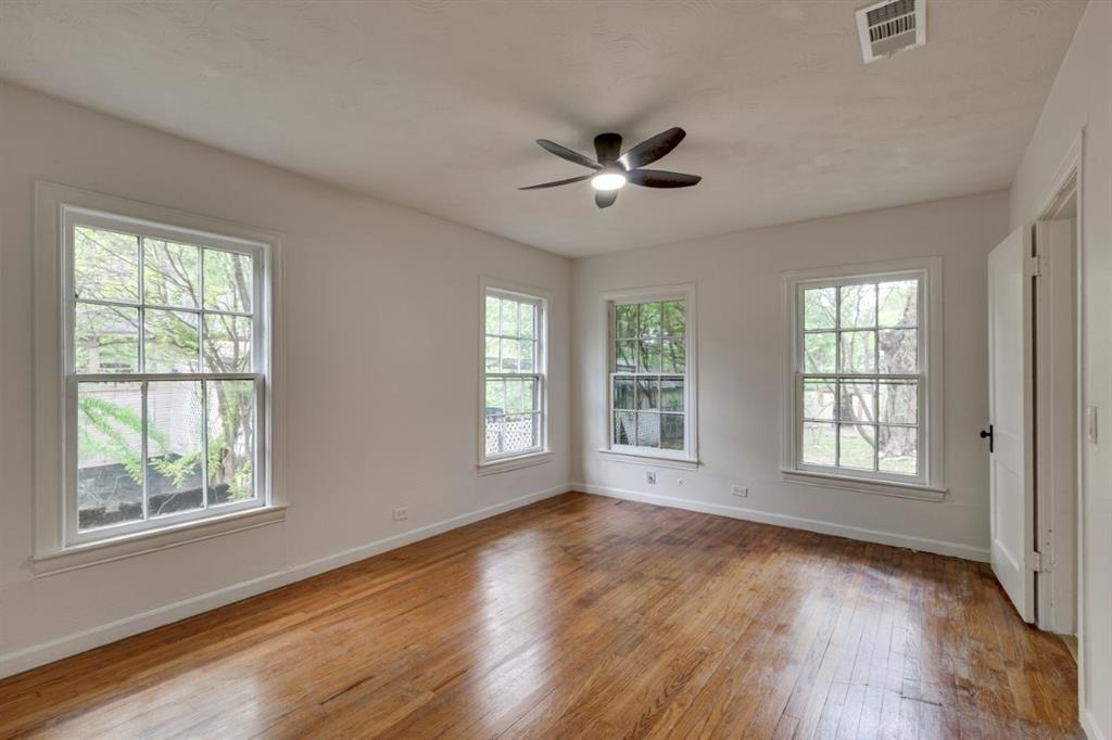 617 Wilson Street Lancaster, TX 75146 - Photo 20 of 30 a view of an empty room with wooden floor and a window