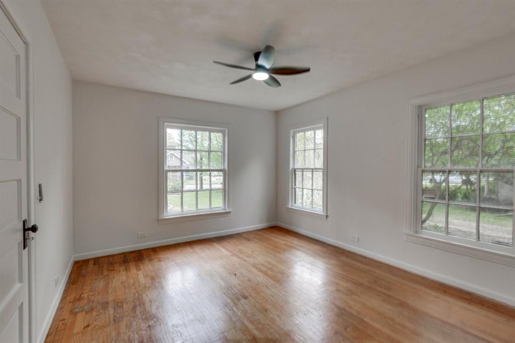 617 Wilson Street Lancaster, TX 75146 - Photo 22 of 30 a view of an empty room with wooden floor and a window